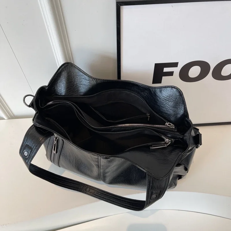 Spacious women's leather shoulder bag, autumn urban style