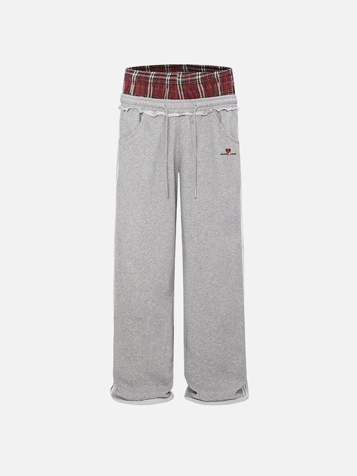 Jazzlyn - Pantalon de jogging grise chic avec une luxueuse ceinture double pour confort et style.