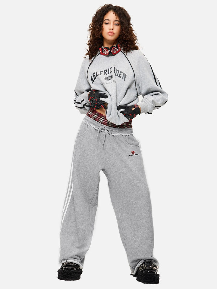 Jazzlyn - Pantalon de jogging grise chic avec une luxueuse ceinture double pour confort et style.