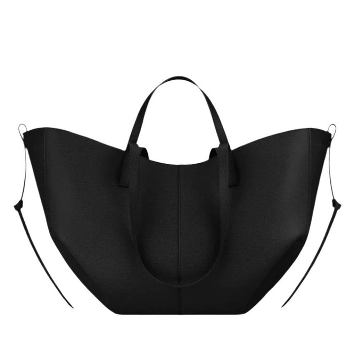 Spacious women's leather tote bag for laptop, ideal for autumn and work