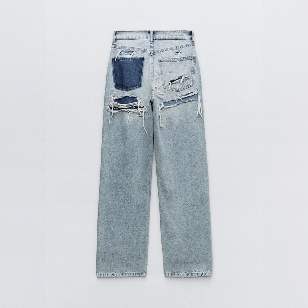 Jean vintage déchiré stylé avec un design patchwork unique