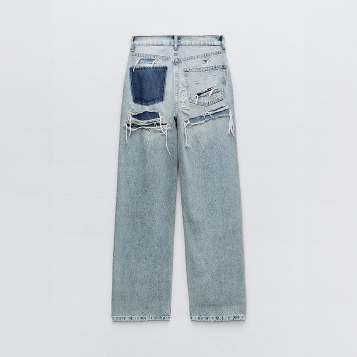Jean vintage déchiré stylé avec un design patchwork unique