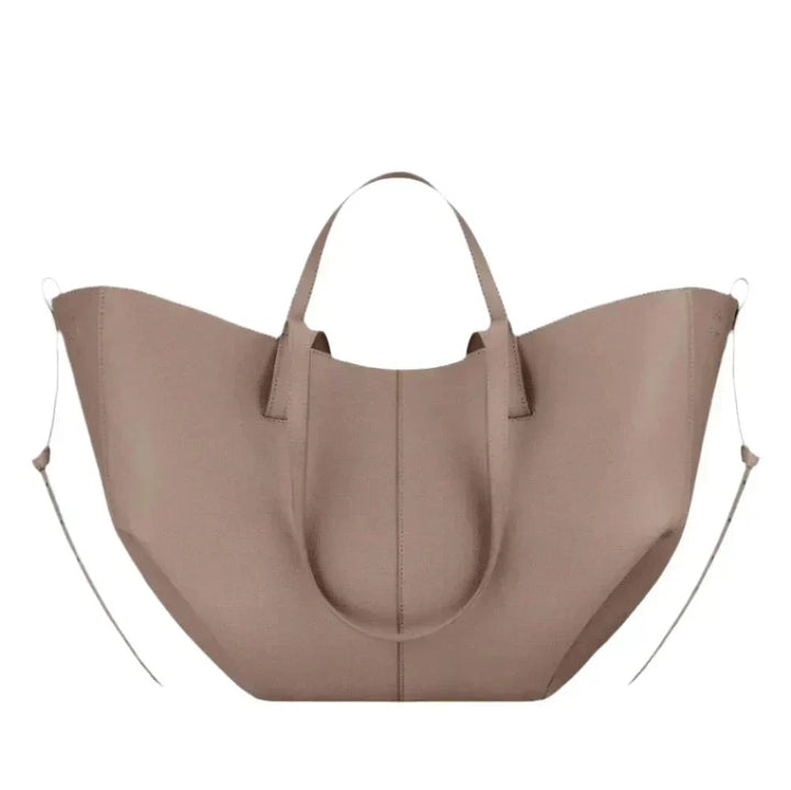 Spacious women's leather tote bag for laptop, ideal for autumn and work