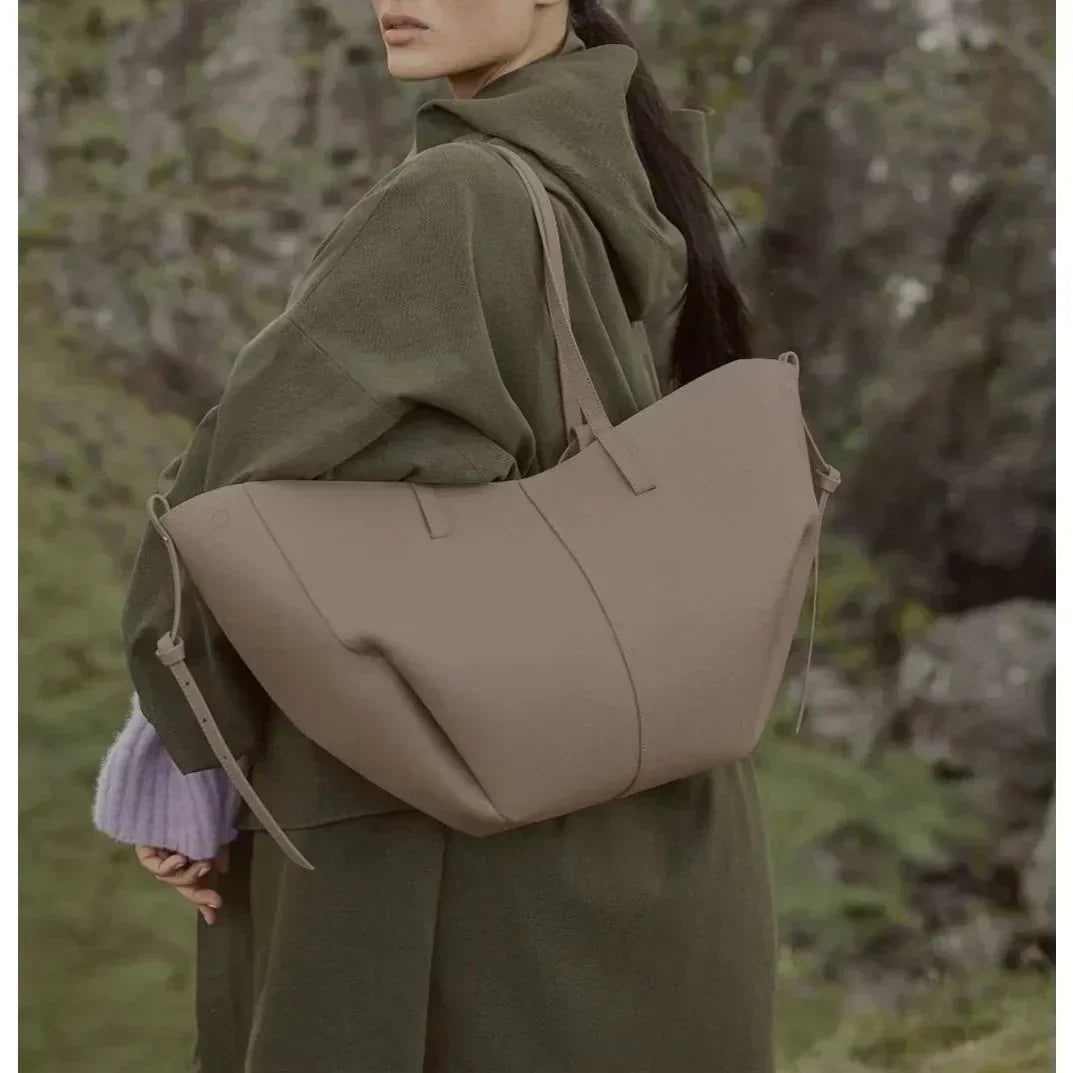 Spacious women's leather tote bag for laptop, ideal for autumn and work