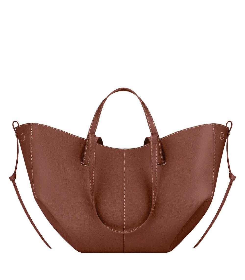 Spacious women's leather tote bag for laptop, ideal for autumn and work