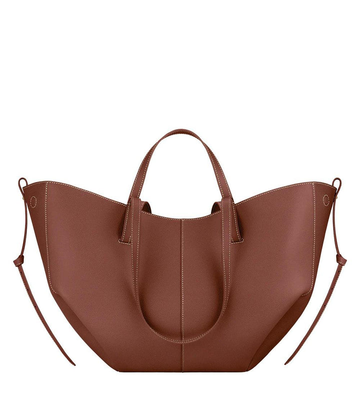 Spacious women's leather tote bag for laptop, ideal for autumn and work