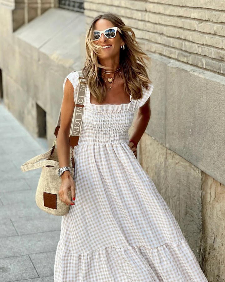 https://cdn.shopify.com/s/files/1/0998/9200/3147/files/Women_s_Smocked_Gingham_Maxi_Dress_with_Ruffle_Sleeves_2.png?v=1766785420