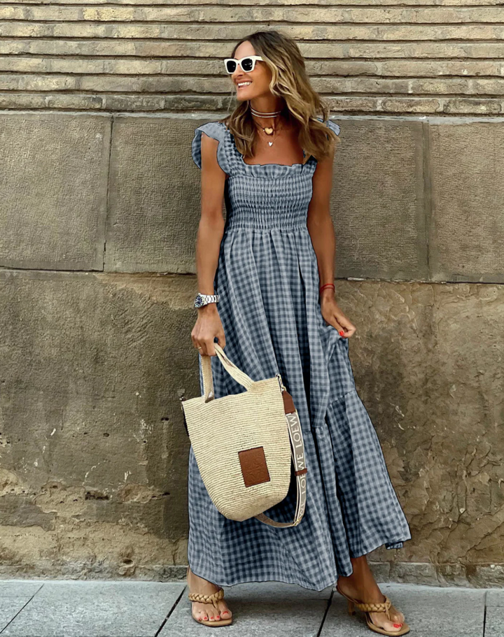 https://cdn.shopify.com/s/files/1/0998/9200/3147/files/Women_s_Smocked_Gingham_Maxi_Dress_with_Ruffle_Sleeves_5.png?v=1766785419