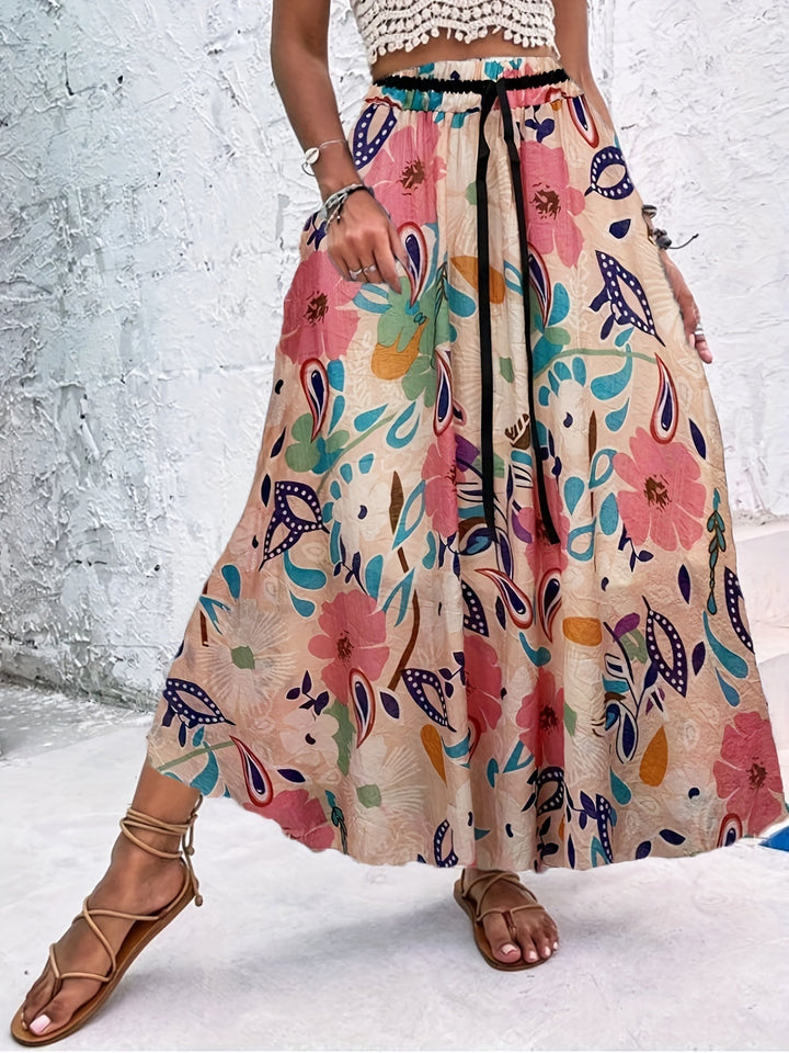 Summer maxi dressing gown with striking polka dots and an elegant bow for a fresh and stylish look.