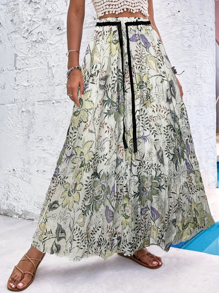 Summer maxi dressing gown with striking polka dots and an elegant bow for a fresh and stylish look.