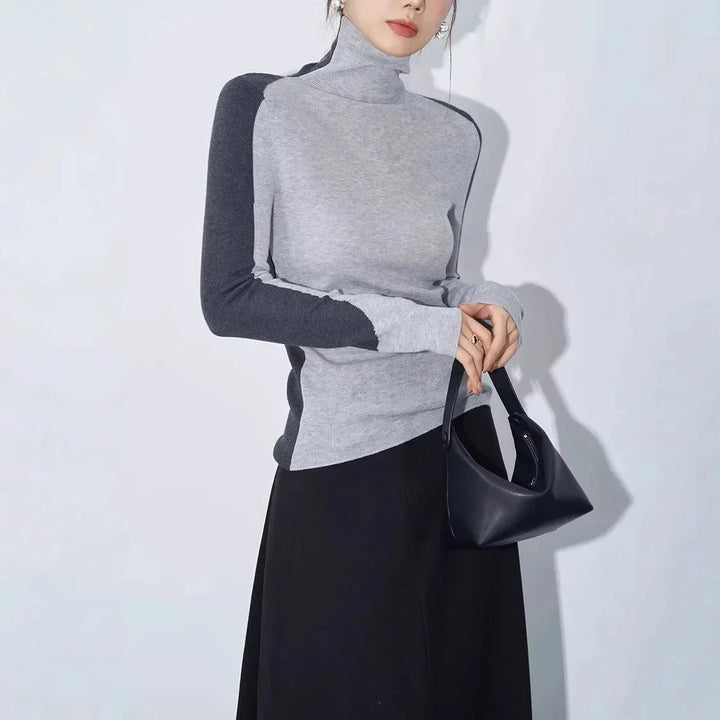 Blouse femme en coton à col montant et manches contrastées, modèle tendance pour l’automne