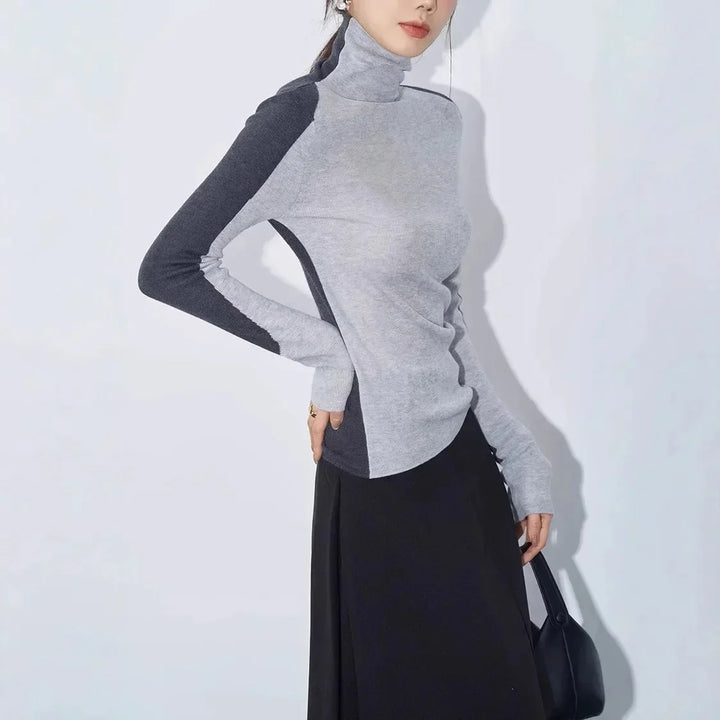 Blouse femme en coton à col montant et manches contrastées, modèle tendance pour l’automne