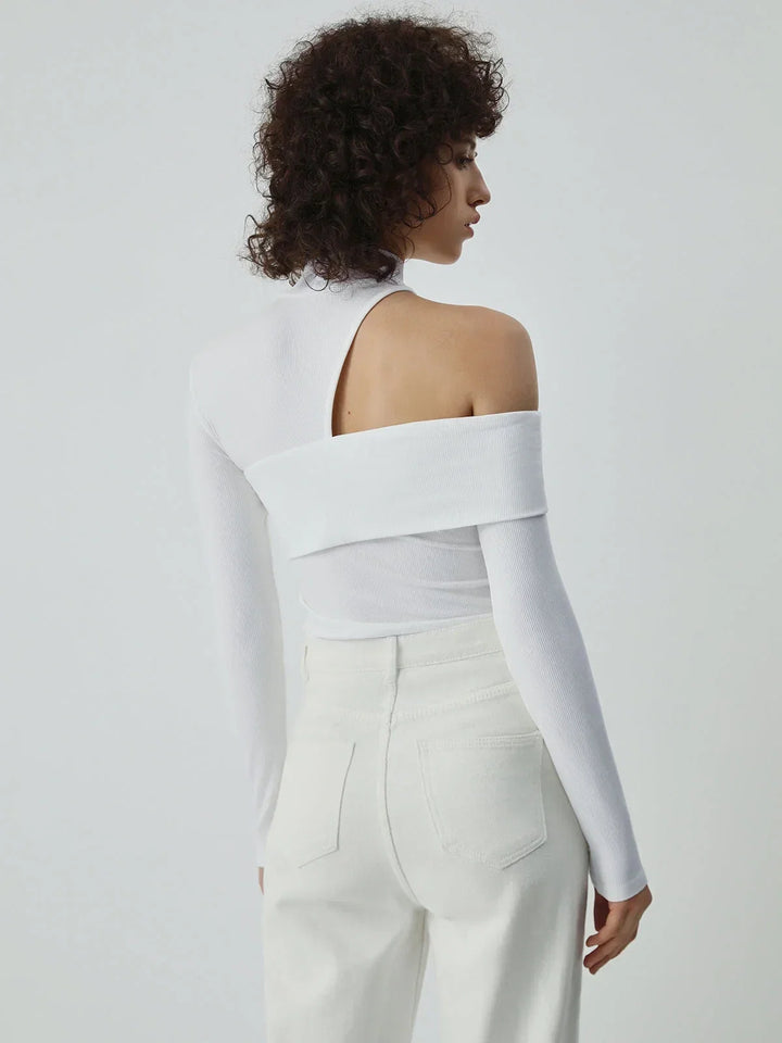 Blouse femme en coton à col montant avec coupe asymétrique et détail ajouré pour l’automne