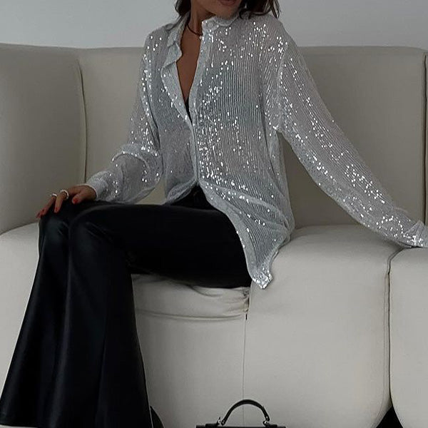 https://cdn.shopify.com/s/files/1/0998/9200/3147/files/loose-blouse-with-shiny-sequins-celeste-black-s-state_of_style-2.jpg?v=1766663464