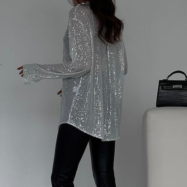 https://cdn.shopify.com/s/files/1/0998/9200/3147/files/loose-blouse-with-shiny-sequins-celeste-black-s-state_of_style-6.jpg?v=1766663465