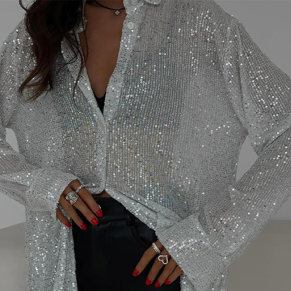 https://cdn.shopify.com/s/files/1/0998/9200/3147/files/loose-blouse-with-shiny-sequins-celeste-black-s-state_of_style.jpg?v=1766663465