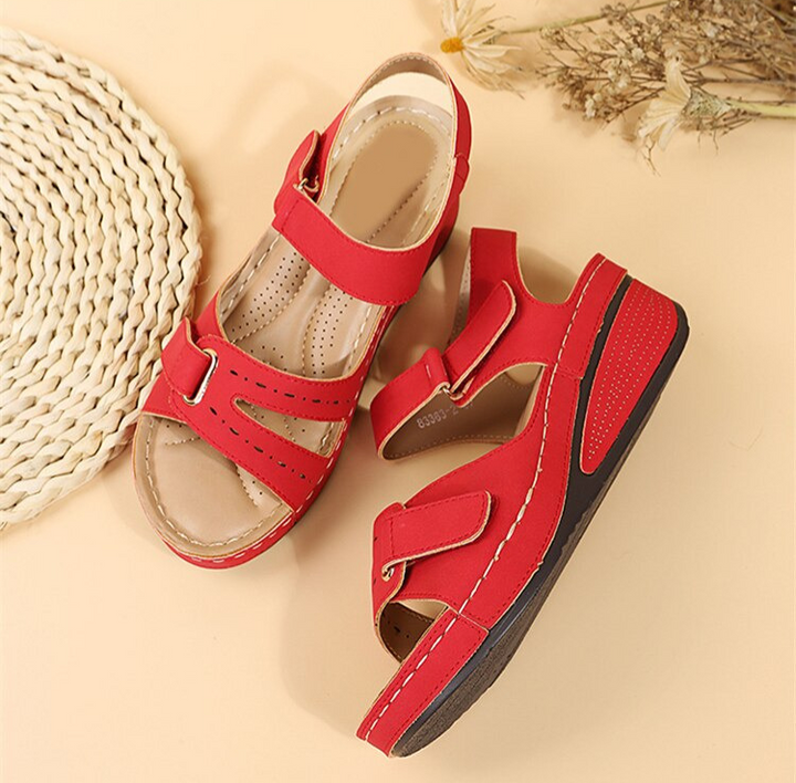 https://cdn.shopify.com/s/files/1/0998/9200/3147/files/odette-orthopedic-sandals-ultimate-comfort-for-long-walks-red-5-state_of_style-2.png?v=1766840318