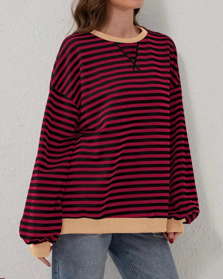 Women’s striped knit pullover with a loose fit, a casual and trendy style for autumn