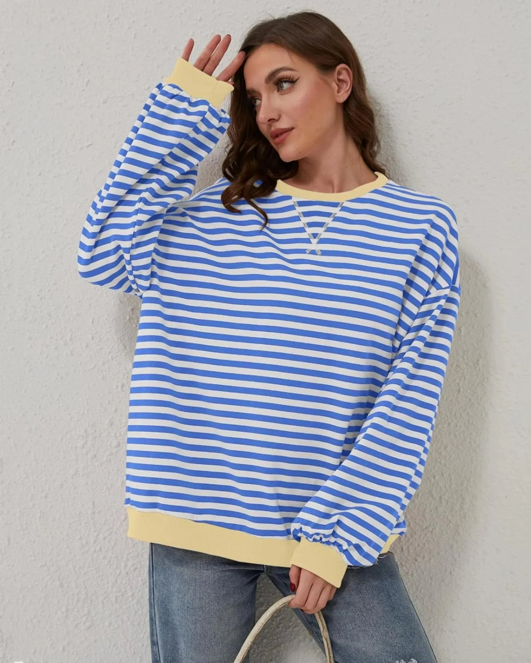 Women’s striped knit pullover with a loose fit, a casual and trendy style for autumn