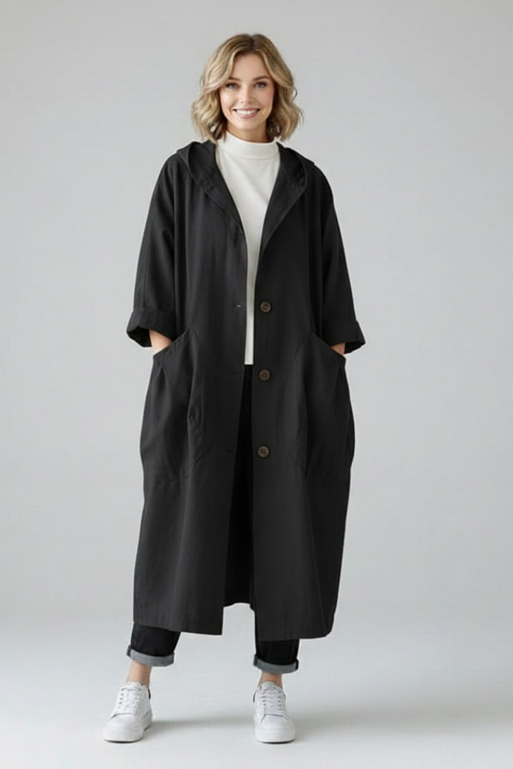 Long oversized women's hooded raincoat for autumn