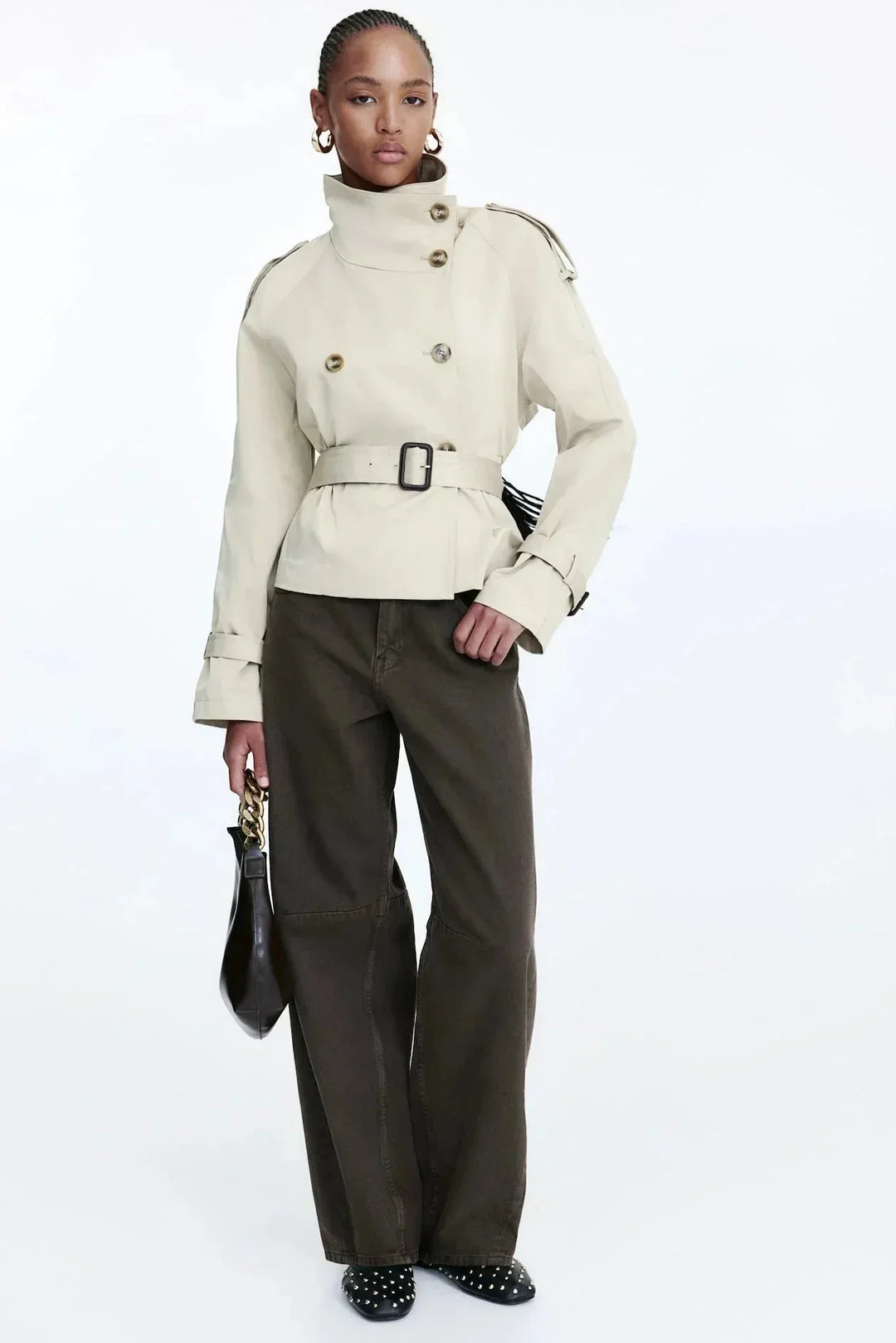 Elegant women’s trench coat with a stand-up collar and tie belt for autumn