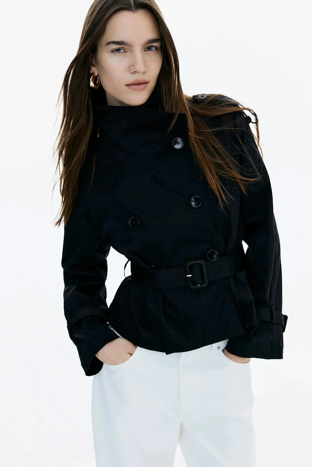 Elegant women’s trench coat with a stand-up collar and tie belt for autumn
