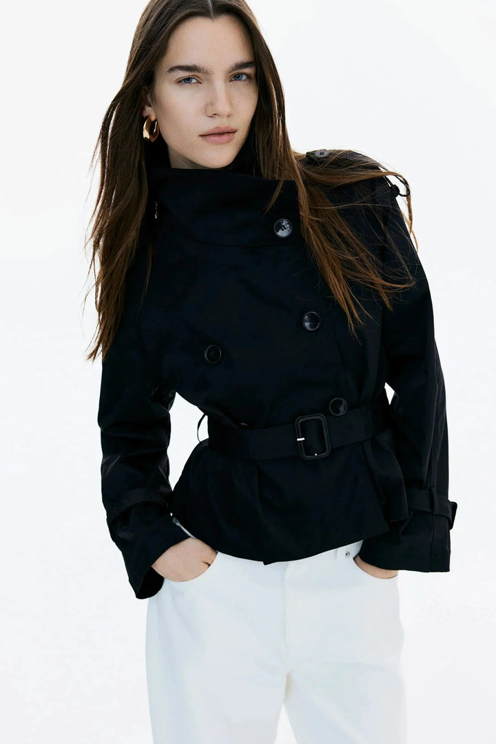 Elegant women’s trench coat with a stand-up collar and tie belt for autumn