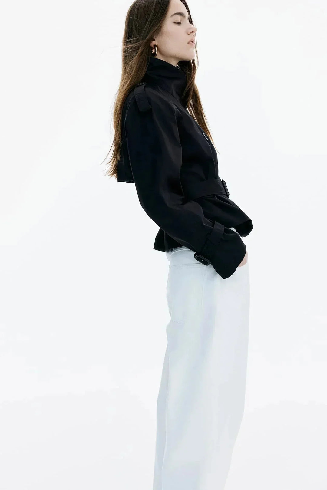 Elegant women’s trench coat with a stand-up collar and tie belt for autumn