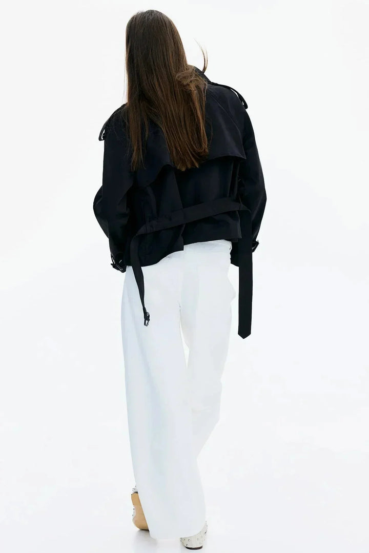 Elegant women’s trench coat with a stand-up collar and tie belt for autumn