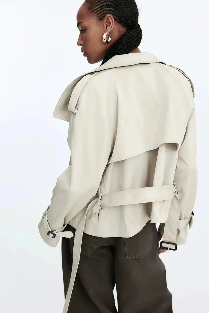 Elegant women’s trench coat with a stand-up collar and tie belt for autumn