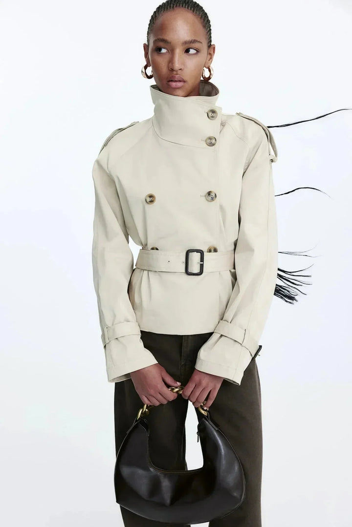 Elegant women’s trench coat with a stand-up collar and tie belt for autumn