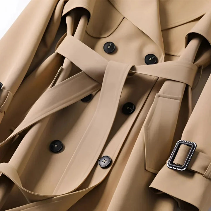 Long trench-style women’s coat with a belt and elegant notched collar for autumn